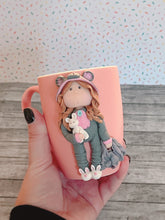 Load image into Gallery viewer, Handmade Polymer Clay 3D Girl in Grey Bear PJs on a Pink Ceramic Mug
