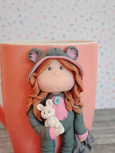 Load image into Gallery viewer, Handmade Polymer Clay 3D Girl in Grey Bear PJs on a Pink Ceramic Mug
