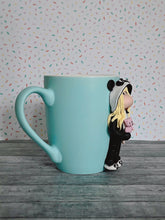 Load image into Gallery viewer, Handmade Polymer Clay 3D Blonde Girl in Panda PJs on a Blue Ceramic Mug
